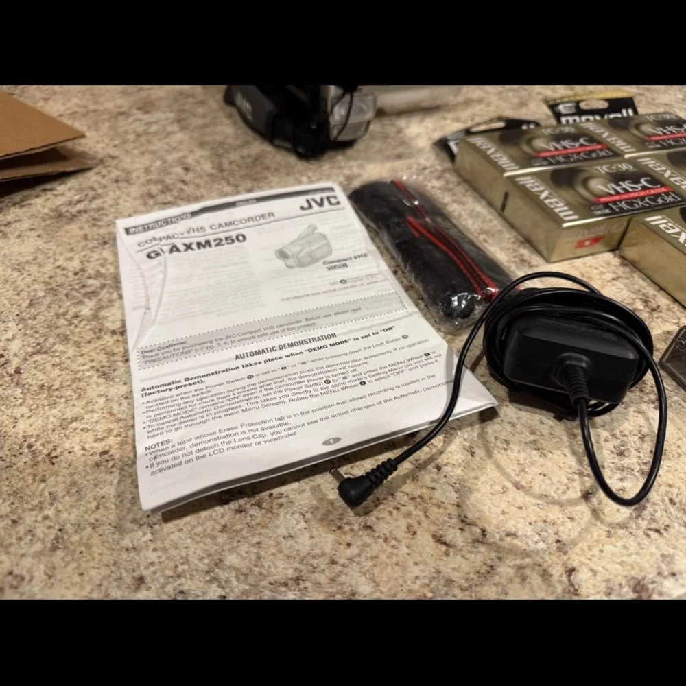 JVC Gray Camcorder with VHS-C Tapes